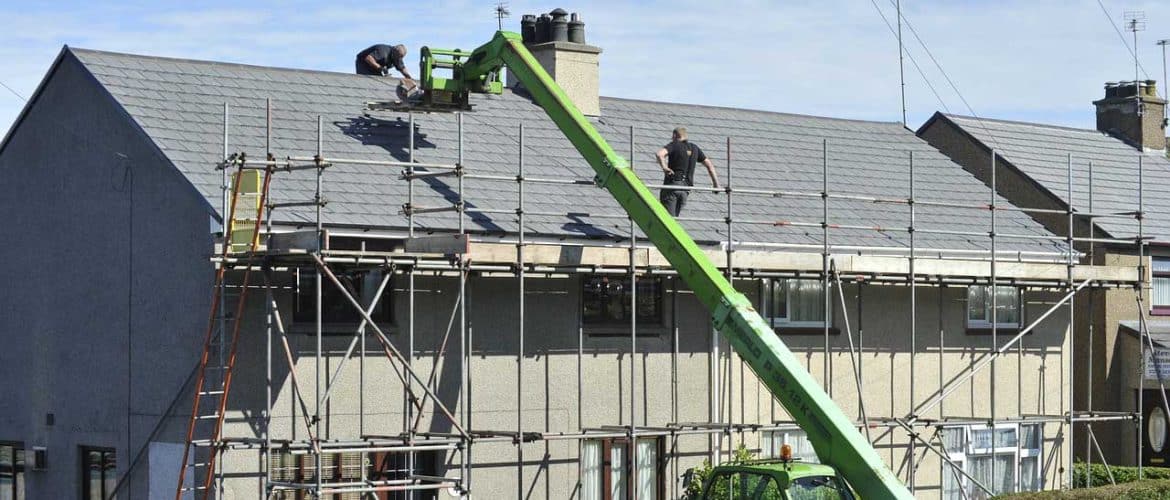 Commercial roof repair experts on roof