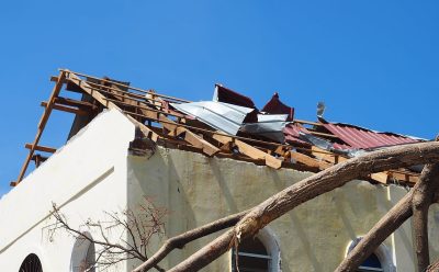 Severely damaged roof after hurricane winds