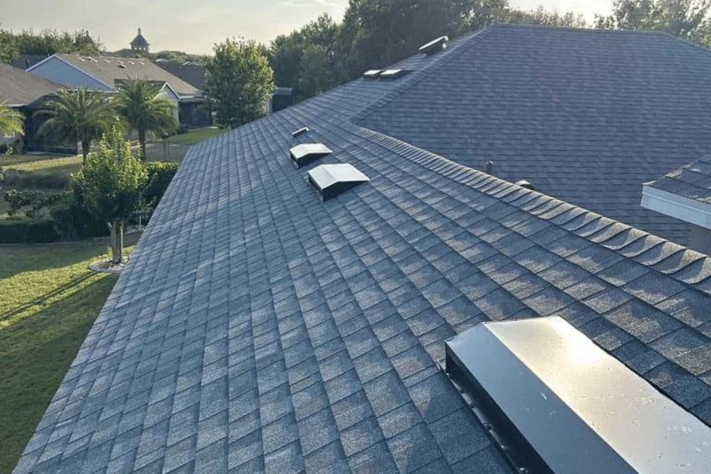 Dark shingle roof with a ridge vent