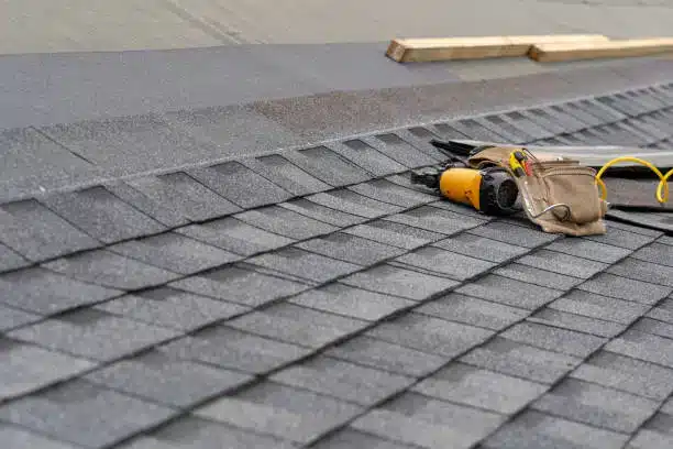 Asphalt shingle roof with roofing tools